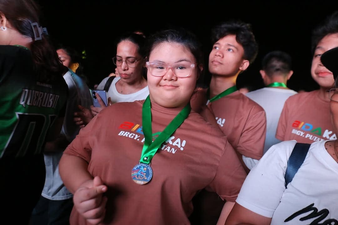 A Proud Medalist at the Awarding Ceremony