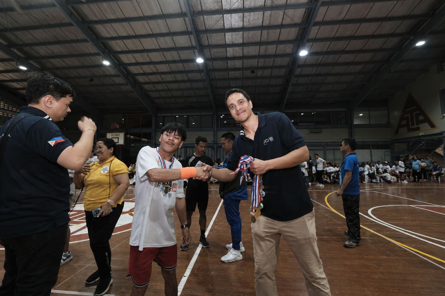 Co-Chairman Roger Braun Congratulates an Athlete